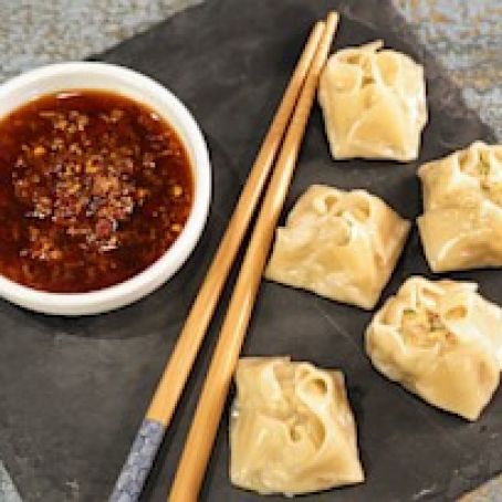 CHICKEN AND SHRIMP DUMPLINGS WITH SPICY GINGER DIPPING SAUCE