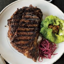Grilled rib-eye with stuffed cabbage and red onion confit