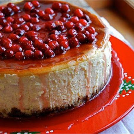 Eggnog Cheesecake with Gingersnap Crust & Pomegranate Glaze