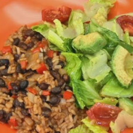 Cuban black beans and rice with avocado, tomato and romaine lettuce salad