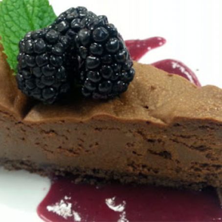 Dark chocolate-espresso cheesecake with triple berry-beet coulis
