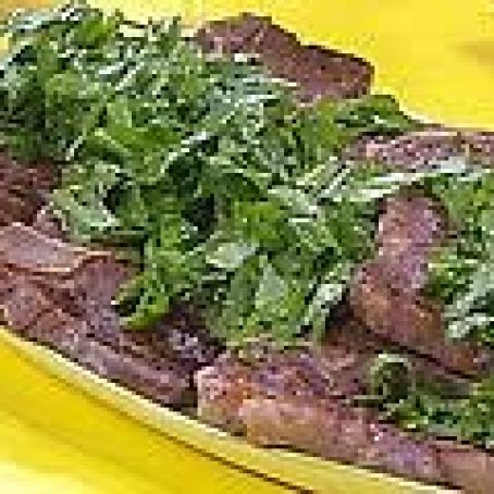 T-Bone Steaks with Chopped Green Garni, Broiled Tomatoes with Cheese, Olives and Herbs