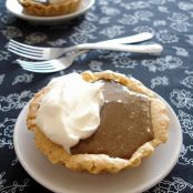 Little hazelnut tartlets with caramel fudge icing