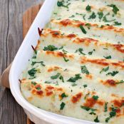 White Chicken Enchiladas with Green Chile Sour Cream Sauce