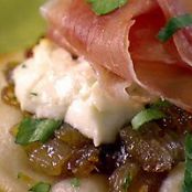 Pizzettes with Caramelized Onions, Goat Cheese, and Prosciutto