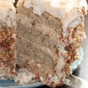 Banana Cake w. Praline Filling & White Chocolate Ganache