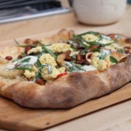 Tarte Flambe with Herbed Creme Fraiche, Aged Cheddar, Caramelized Vidalia, Double Smoked Bacon, Softly Scrambled Eggs and Goat Cheese