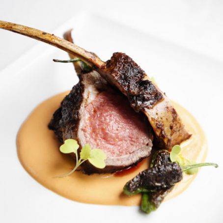 Roasted Marinated Lamb Lollipops with Charred Shishito Peppers and Romesco Sauce