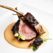 Roasted Marinated Lamb Lollipops with Charred Shishito Peppers and Romesco Sauce