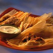 Red Chili Brisket Tamales with Cilantro Sour Cream