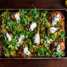 Roasted chicken with potatoes, arugula and garlic yogurt