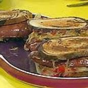 Grilled Split Kielbasa Reubens with Warm Mustard-Caraway Sauerkraut