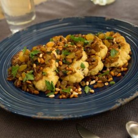 Cauliflower Steaks Roasted with Golden Raisins and Pine Nuts