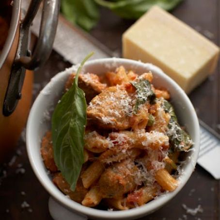 PENNE WITH SPICY ITALIAN SAUSAGE, CREAM, TOMATOES AND PEAS