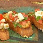 Bruschetta with tomatoes, fresh mozzarella cheese and basil