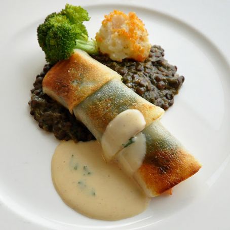 Salmon in a Potato Crust Florentine served with a Roasted Garlic Cream Sauce