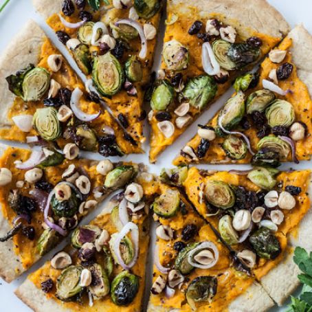 Butternut Squash Pizza with Glazed Brussels Sprouts Hazelnuts & Dates