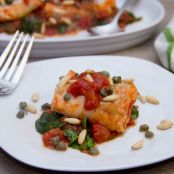 Cod Poached in Tomato Sauce with Spinach, Capers, and Pine Nuts