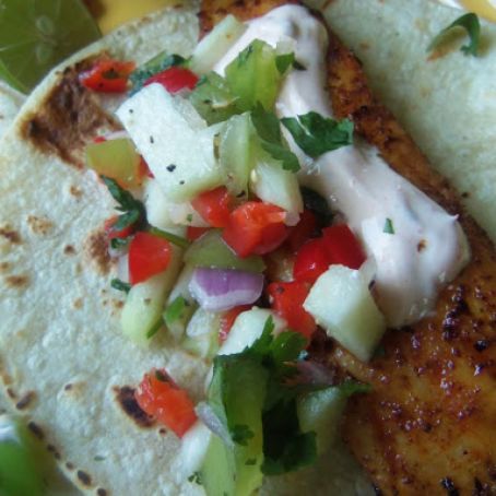 Blackened Tilapia Tacos Topped With Chayote-Tomatillo Salsa & Light Chipotle Crema