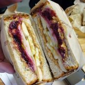 Healthy PBJ sandwich with apple, cranberry and banana.