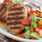GREEK-STYLE PORK CHOPS WITH TOMATO-CUCUMBER SALAD