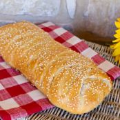 Stromboli with Olives, Sun-Dried Tomatoes, Ham, Salami, and Cheese