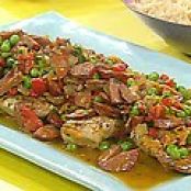 Chicken with Roasted Red Pepper, Chorizo and Sweet Pea Sauce over Rice