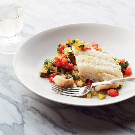 Olive Oil-Poached Hake on Sautéed Zucchini with Tomatoes