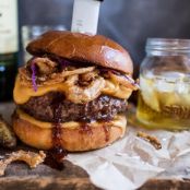 Jameson Whiskey Blue Cheese Burger with Guinness Cheese Sauce + Crispy Onions.