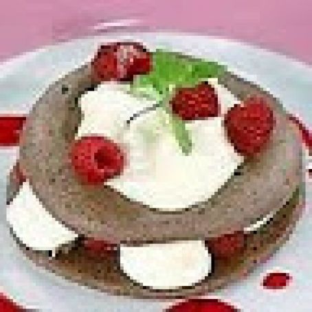 White Chocolate Mousse in Chocolate Meringue Shells with Raspberry Coulis