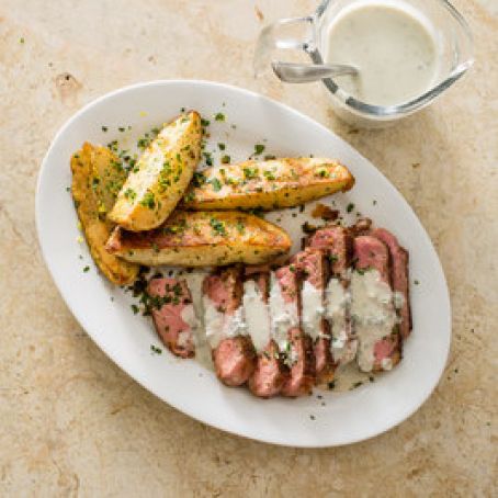 Steak with Lemon Parsley Potato Wedges and Blue Cheese Sauce