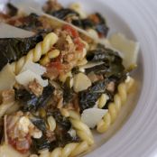 Pasta With Spicy Sausage, Ricotta, Golden Raisins, And Pine Nuts