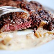 Grilled Ribeye Steak with Onion Blue Cheese Sauce