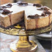 Spiced Pumpkin Cheesecake with Caramel Bourbon Sauce