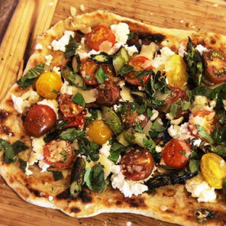 Grilled Pizza with Grilled Tomatoes, Asparagus, Goat Cheese & Marcona Almonds