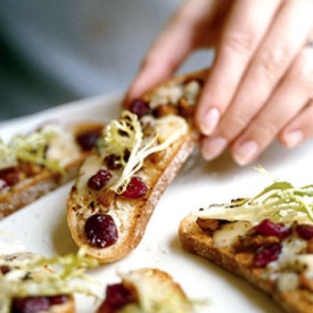 Frisée Salad with Blue Cheese, Walnut, and Cranberry Crostini