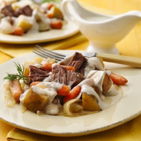 Slow Cooker Pot Roast with Creamy Dill Sauce Draped over tender beef, carrots and potatoes, a creamy dill sa