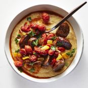 Old Bay Cheddar Grits With Andouille & Tomatoes