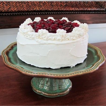 Cherry-Topped White Cake with Whipped Cream Frosting