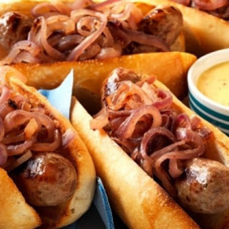 BEER-SIMMERED BRATS WITH CHEESE SAUCE