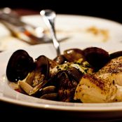 Cod roasted with Clam sauce, New Potatoes and Spinach