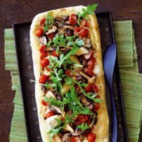 Mushroom and Tomato Flatbread Topped with Fresh Arugula
