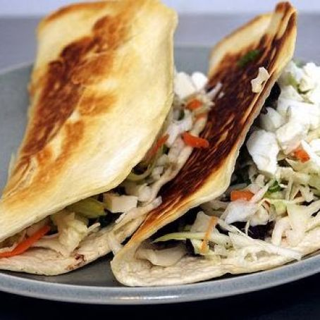 Crisp black bean tacos with feta and slaw