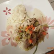 Chicken breasts poached in a savory sauce