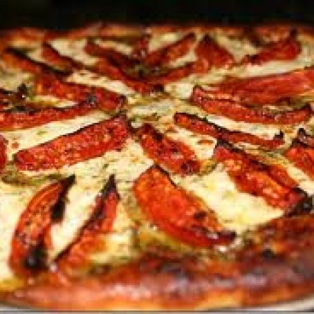 Pizza with Pesto, Fresh Toatoes, and Mozzarella