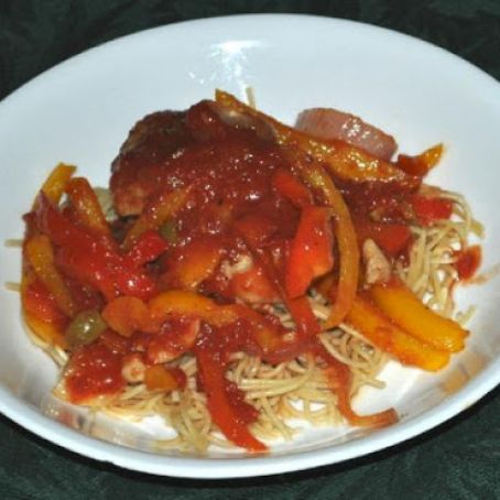 Braised Chicken Thighs With Bell Peppers, Olives and Tomatoes