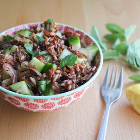 Red rice salad with cucumbers, cilantro and mint