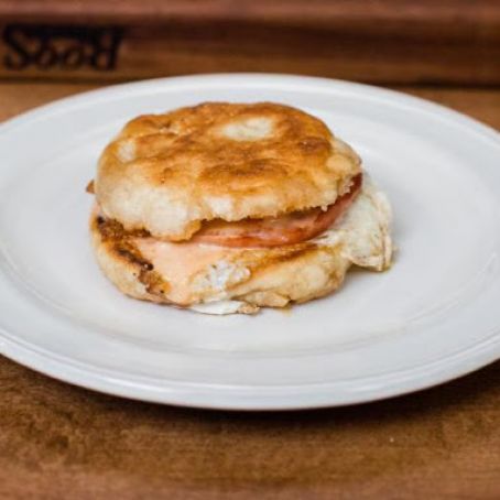 Eggs-in-a-Hole Benedict with Roasted Garlic and Tomato Hollandaise