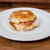 Eggs-in-a-Hole Benedict with Roasted Garlic and Tomato Hollandaise