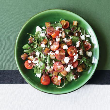 Wilted Arugula Salad with Crisp Potatoes, Feta & Warm Black Olive Vinaigrette